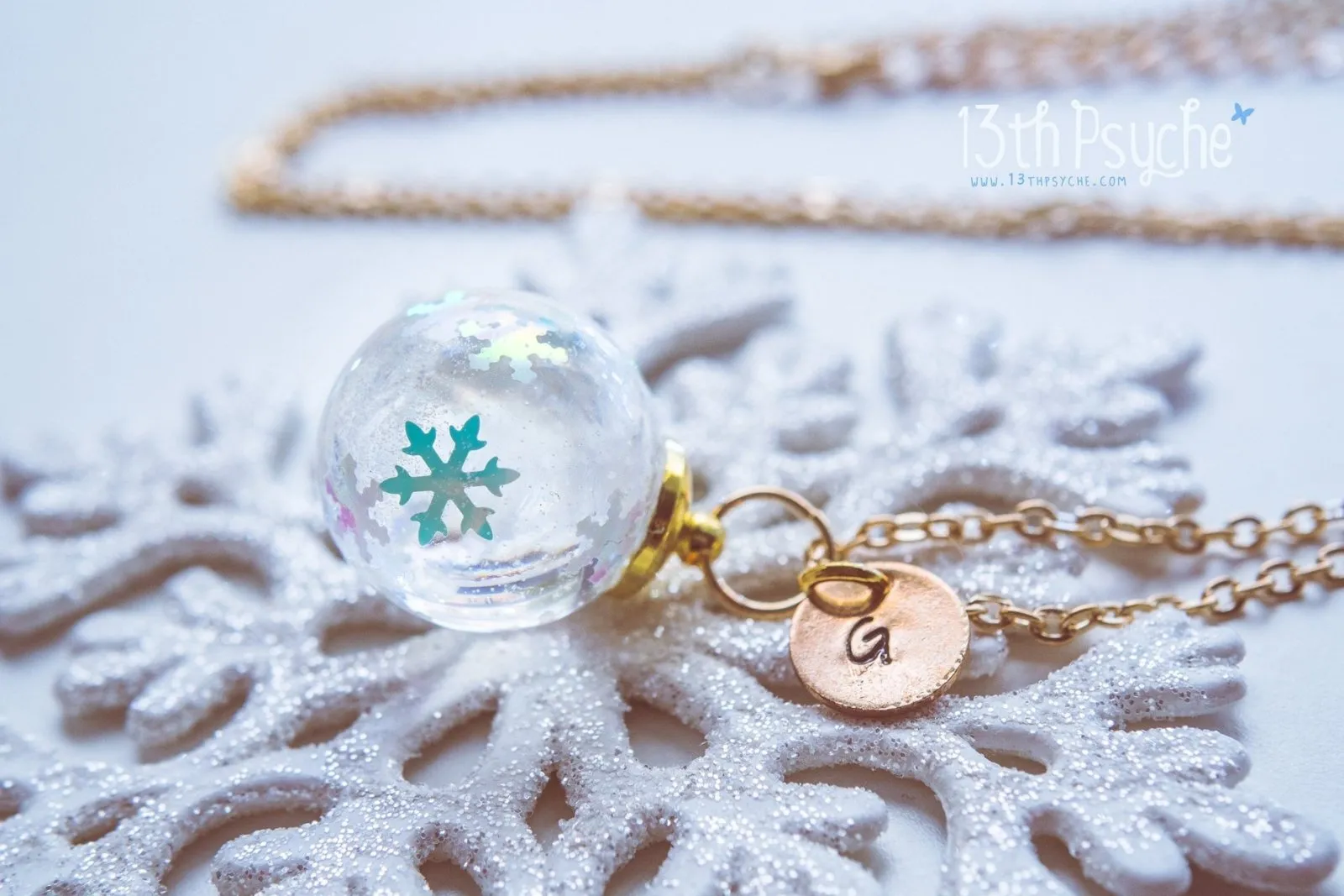 Winter inspired snowflake resin ball necklace